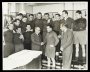 Image of : Photograph - Ernest Green, Chairman, greeting Peter Farrell, Captain, and the rest of the Everton Team with Cliff Britton, (Manager)