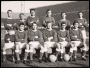 Image of : Photograph - Everton F.C. team. Sandy Brown, Tony Kay, Brian Labone, Gordon West, Mick Meagan, Brian Harris. Seated, mascot, Alex Scott, Dennis Stevens, Jimmy Gabriel, Roy Vernon, Derek Temple