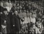 Image of : Photograph - John McKenna, President of the Football League handing the Football League trophy to Dixie Dean. The rest of the team are in the background.